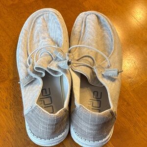 Women’s tan animal print Hey Dudes.